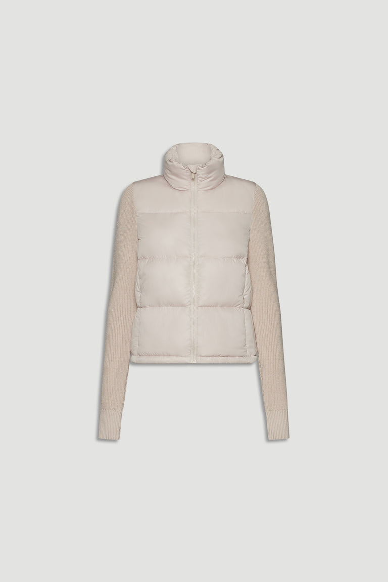 Light beige knit puffer jacket with quilted front and ribbed long sleeves and high collar detailing