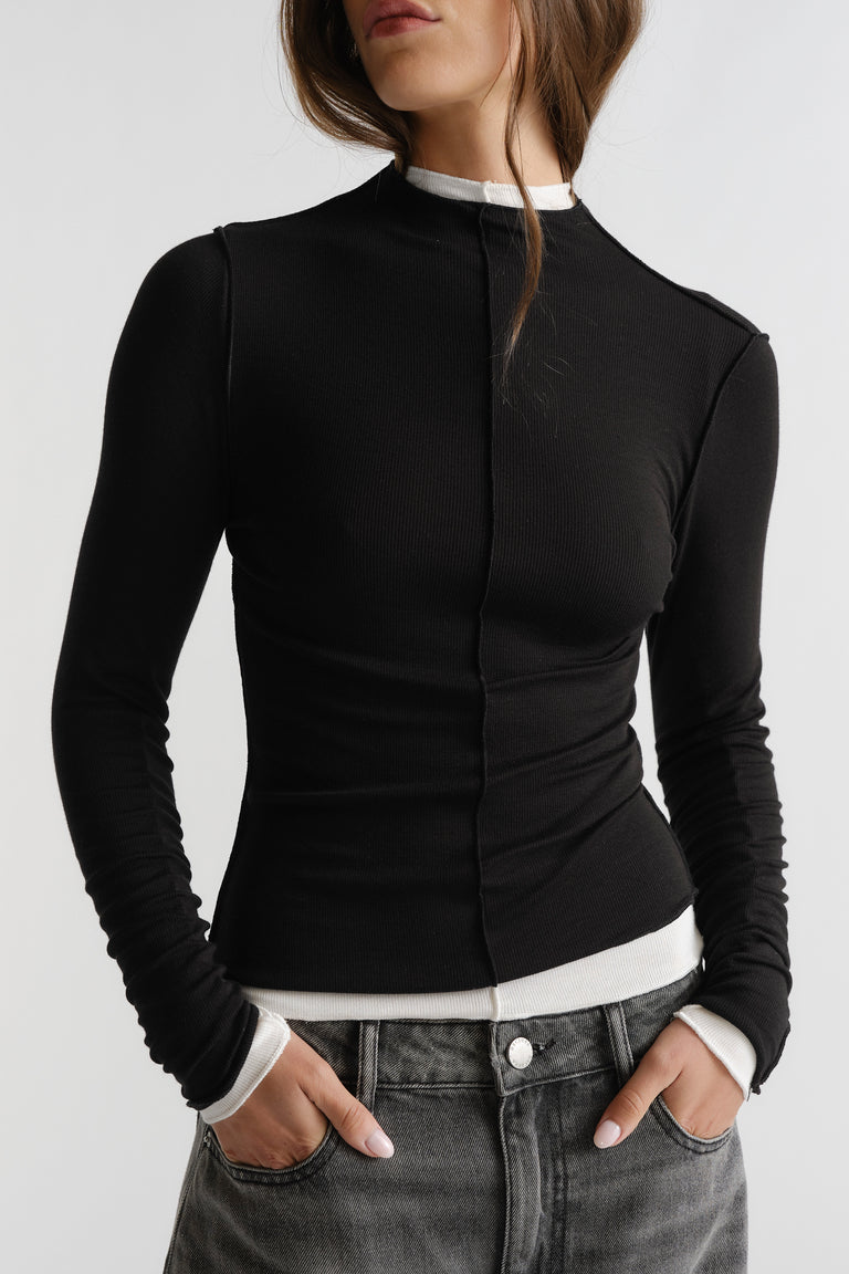 D-Luxe Semi Sheer Long Sleeve in black with ruched sleeves and slim fit styled with casual denim by DECJUBA Australian fashion brand