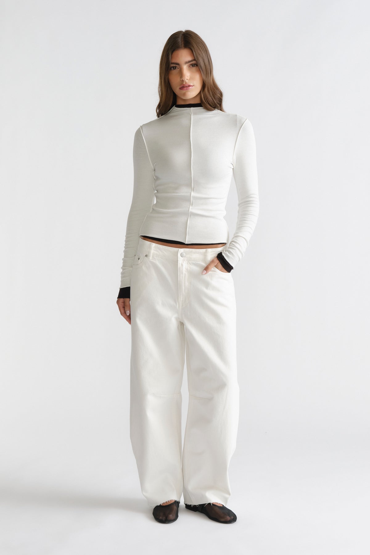 D-Luxe Semi Sheer Long Sleeve in sleek white with contrasting black trim, paired with wide-leg white jeans by DECJUBA Australian fashion brand