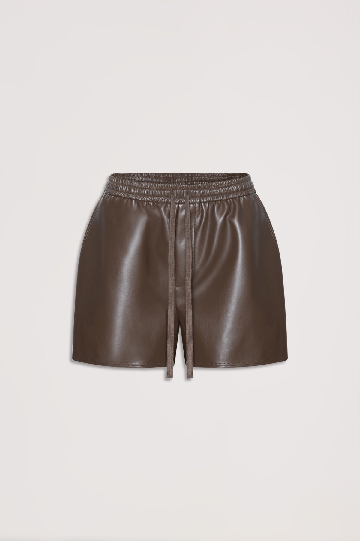 Brown faux leather shorts with an elastic waist and drawstring, designed for versatile everyday style.