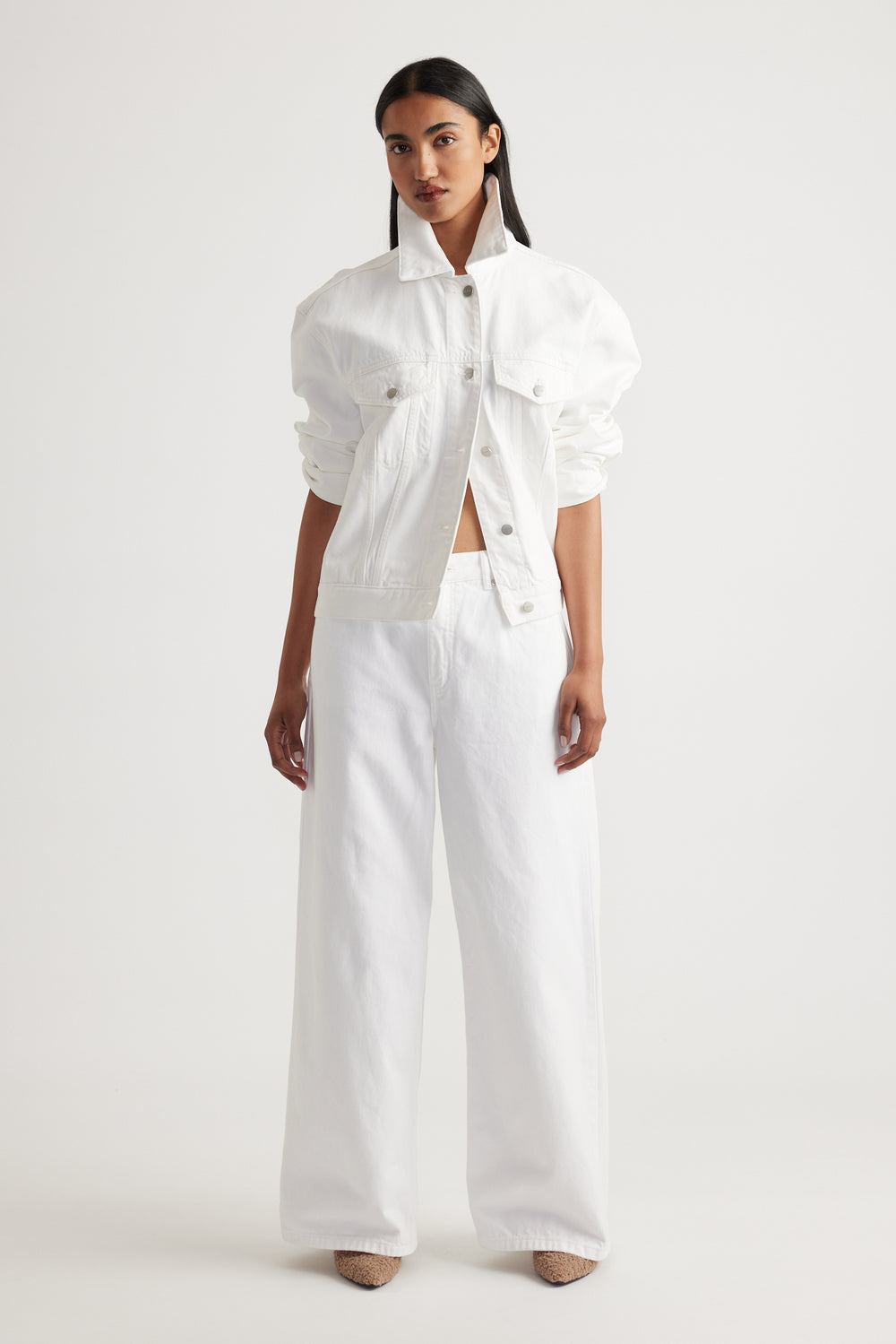 Model showcasing Elena Wide Leg Jean in crisp white denim styled with matching white jacket by Decjuba Australian brand
