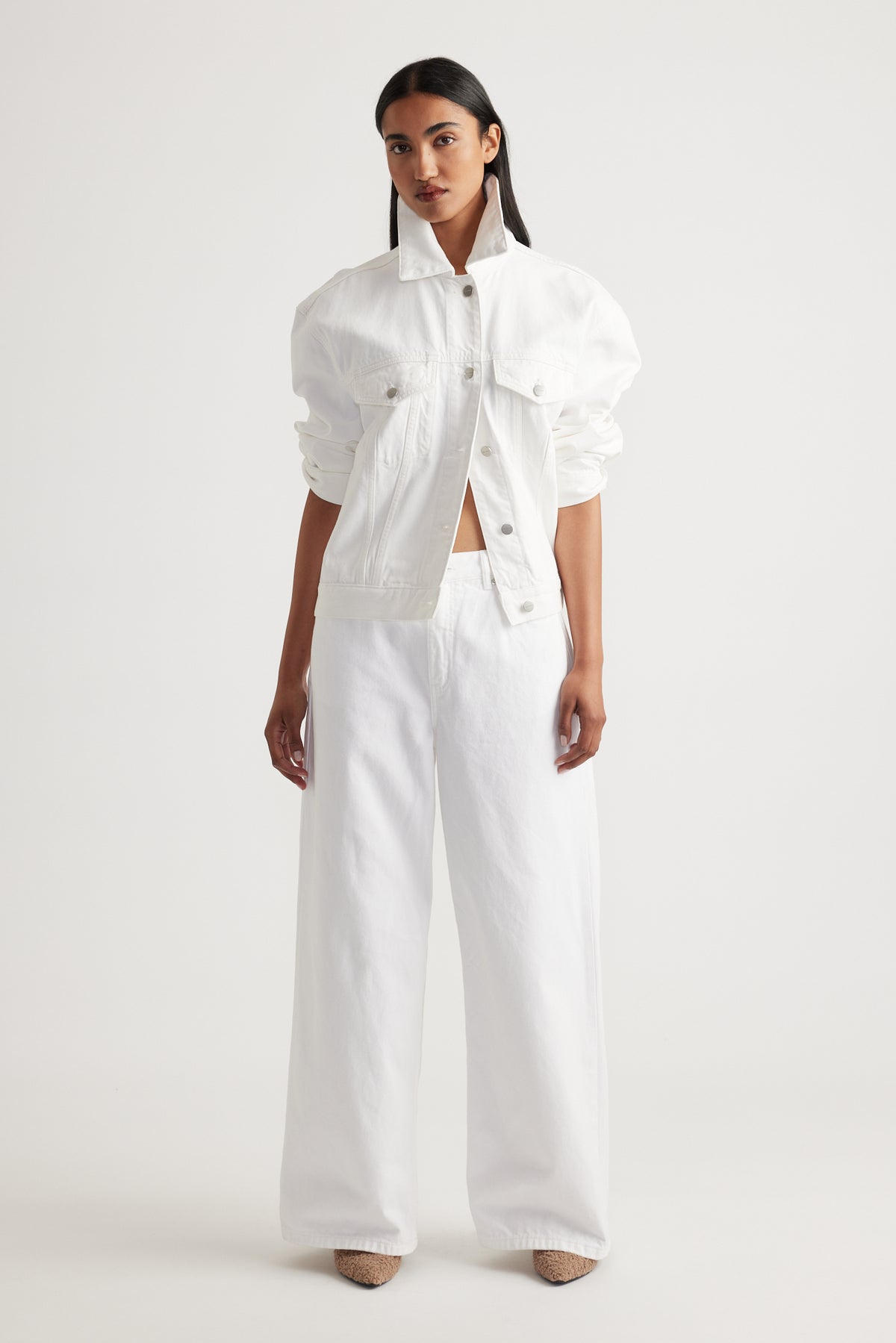 Model showcasing Elena Wide Leg Jean in crisp white denim styled with matching white jacket by Decjuba Australian brand
