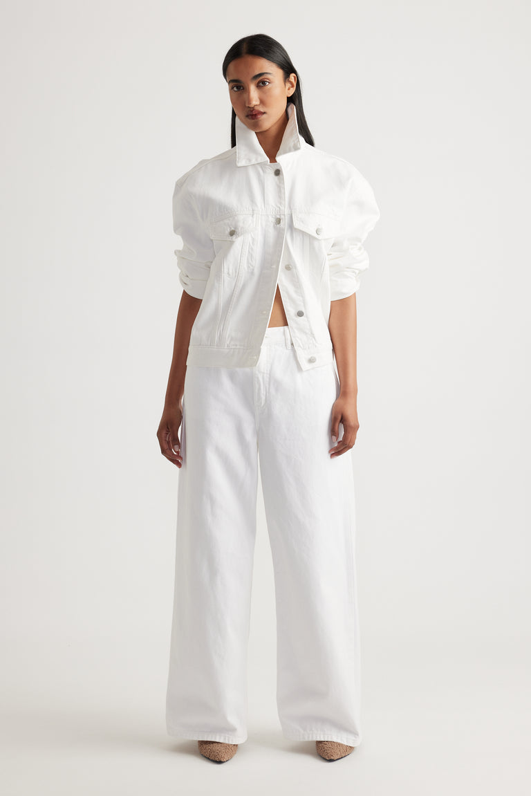 Model showcasing Elena Wide Leg Jean in crisp white denim styled with matching white jacket by Decjuba Australian brand