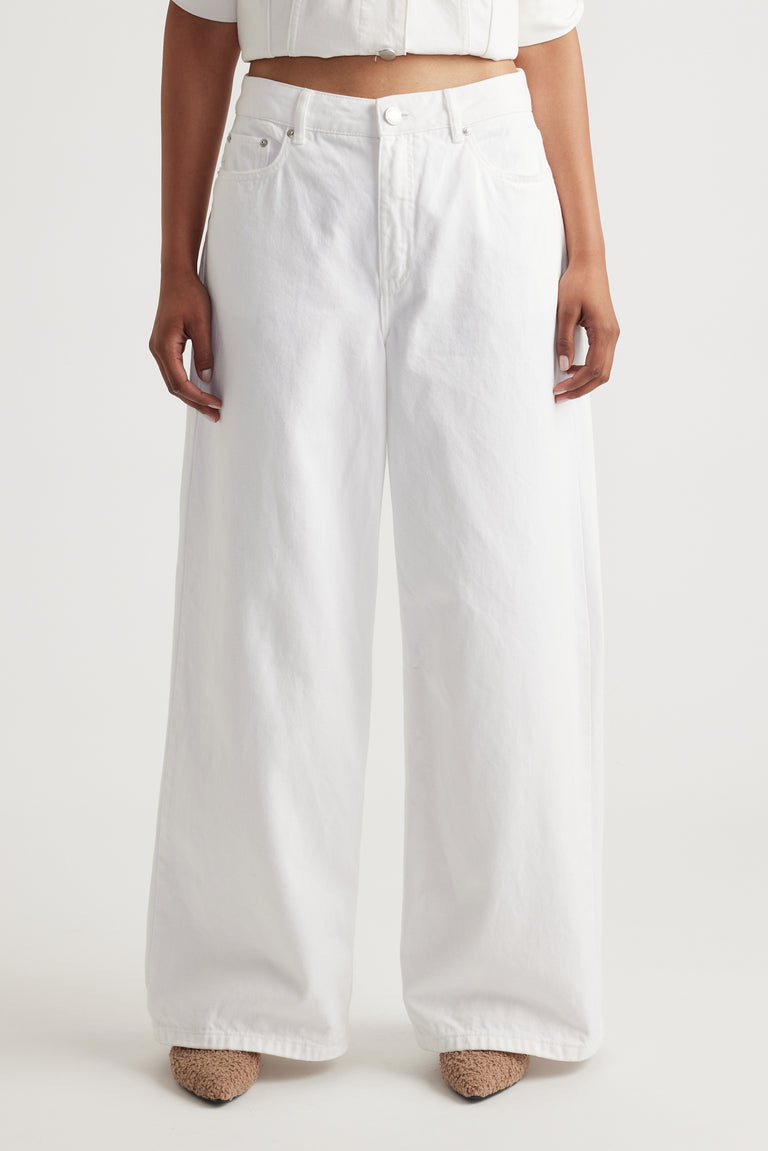 Front view of woman wearing white Elena Wide Leg Jean in 100% cotton denim by Decjuba Australian fashion brand