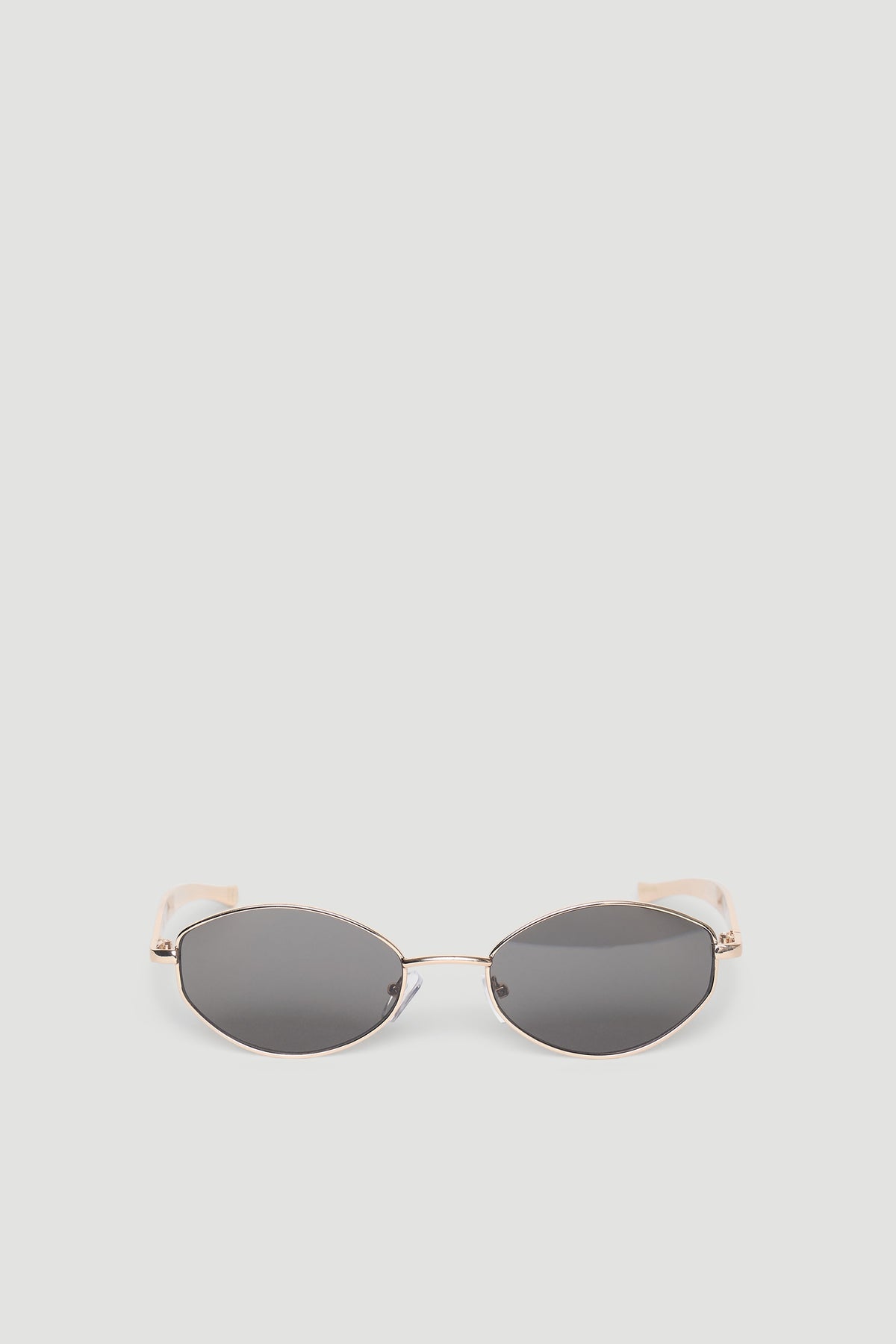 Sleek round metal sunglasses with thin gold-tone frames and dark tinted lenses for a stylish everyday look