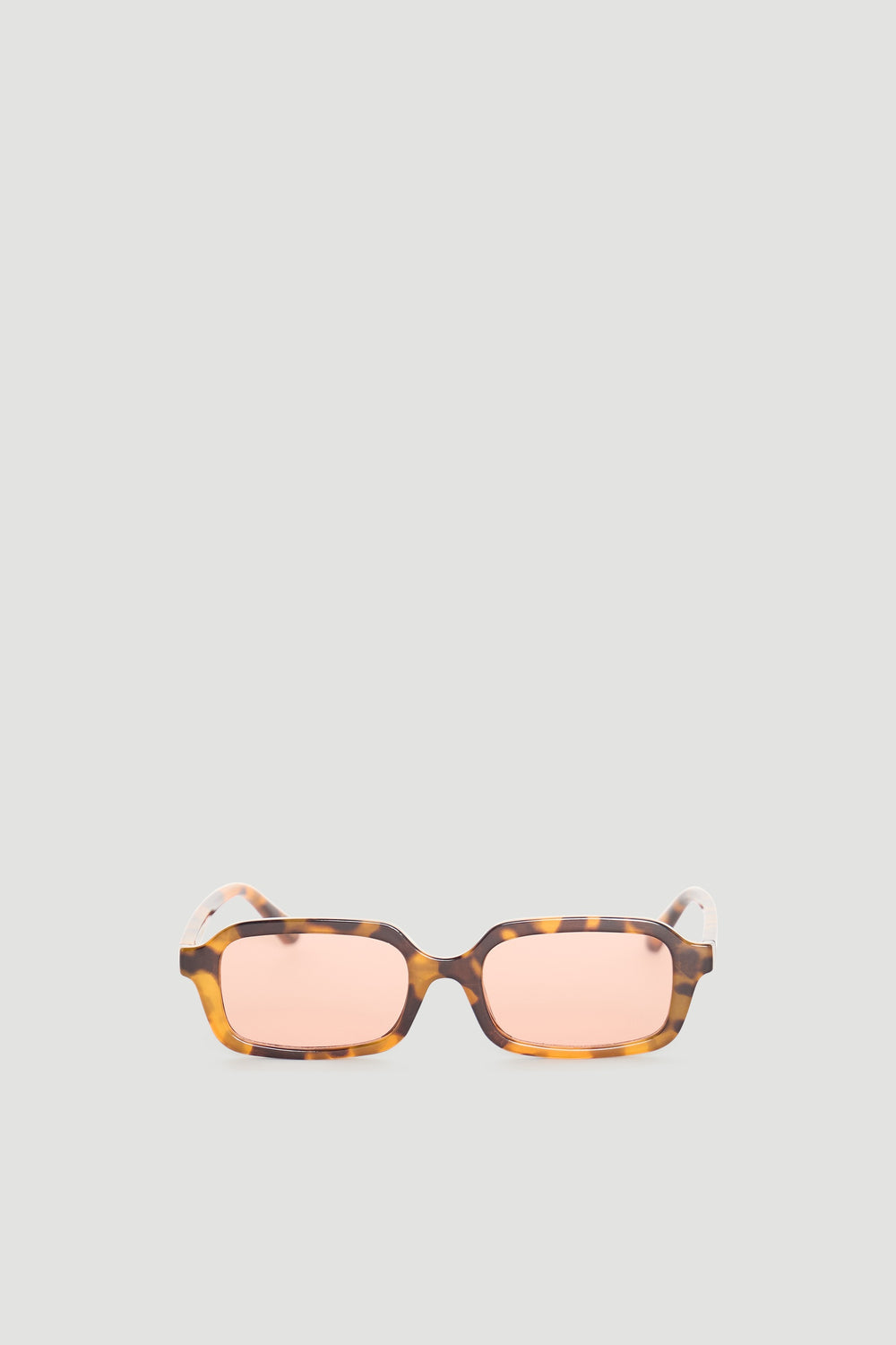 Rectangle sunglasses with warm tortoiseshell frame and soft peach-tinted lenses for a stylish, modern look.