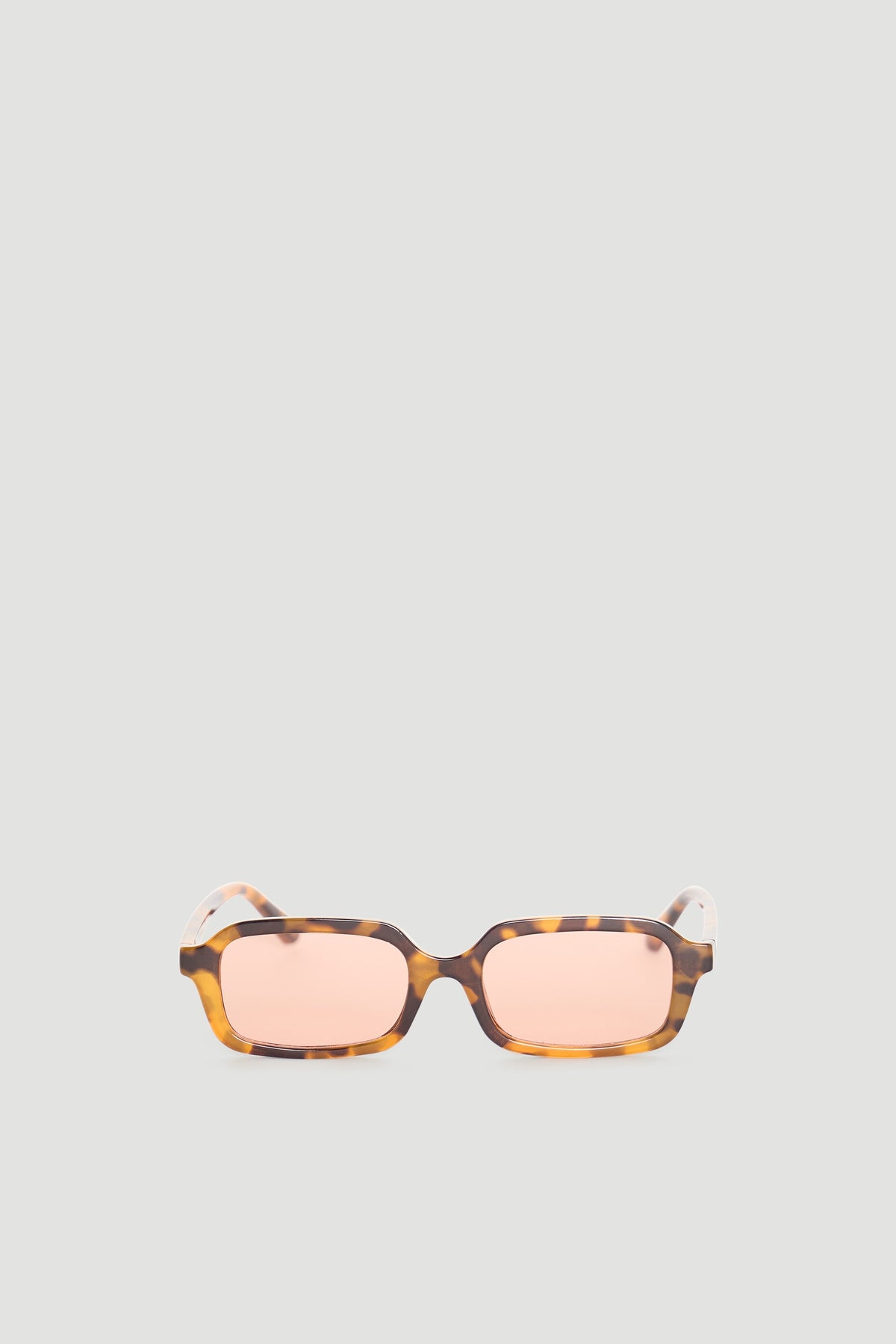 Rectangle sunglasses with warm tortoiseshell frame and soft peach-tinted lenses for a stylish, modern look.
