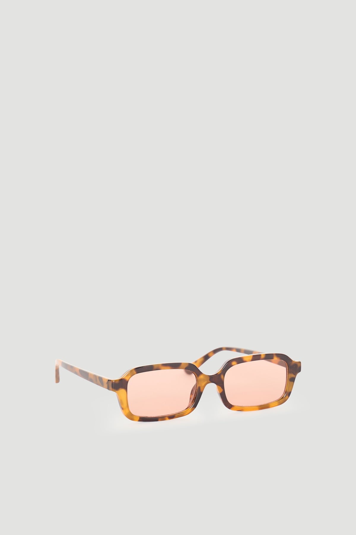 Rectangular sunglasses with a brown tortoiseshell frame and soft pink lenses for a stylish, modern look.