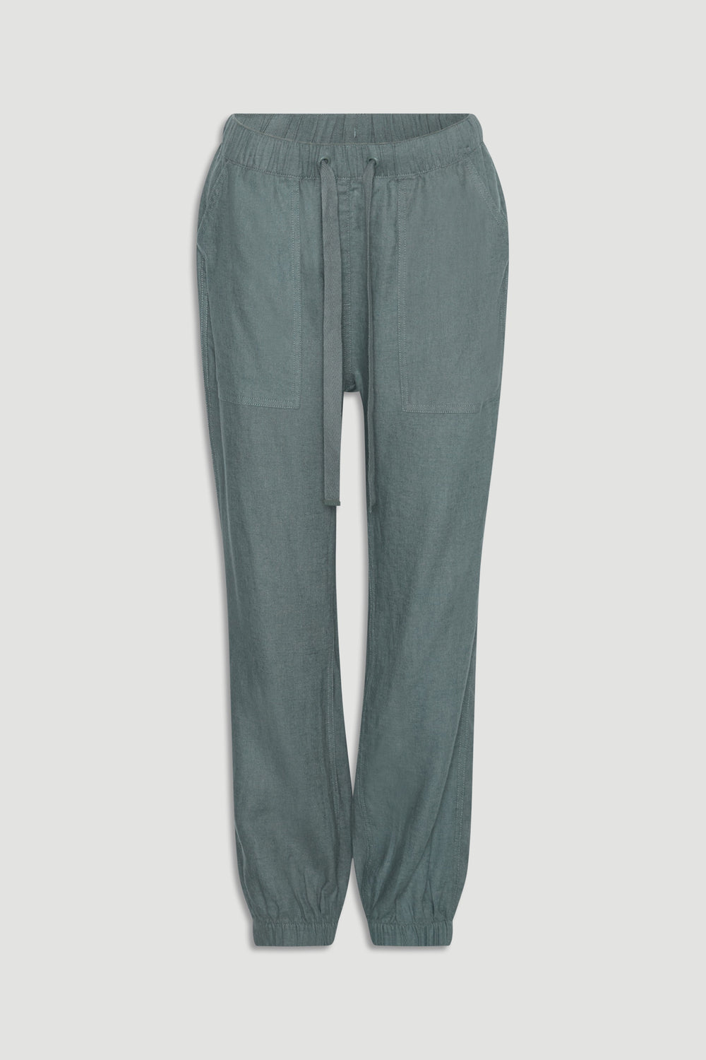 Thyme green linen blend joggers with elastic cuffs, large front pockets, and adjustable drawstring waistband.