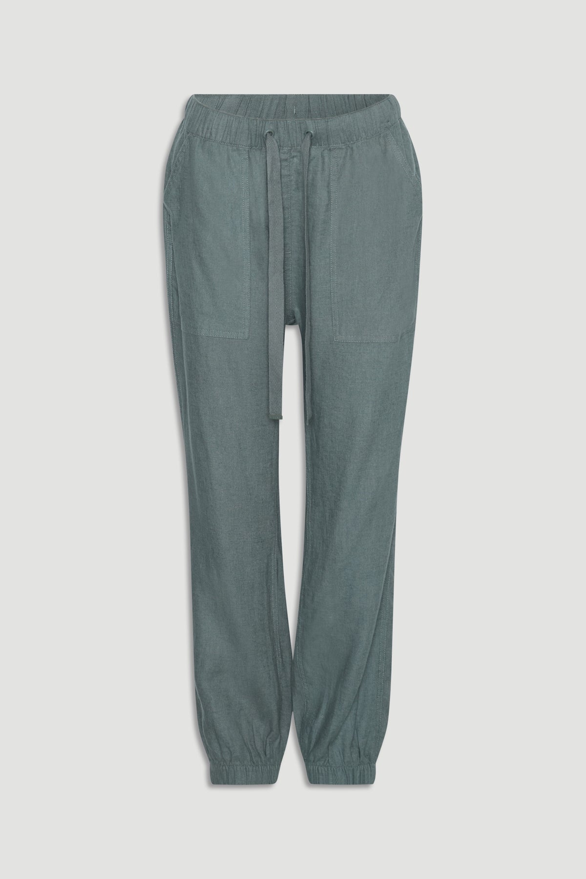 Thyme green linen blend joggers with elastic cuffs, large front pockets, and adjustable drawstring waistband.