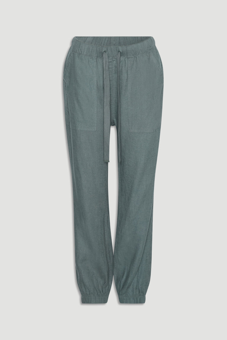 Thyme green linen blend joggers with elastic cuffs, large front pockets, and adjustable drawstring waistband.