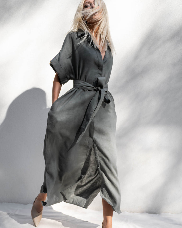 Woman wearing D-Luxe Linen Blend Midi Dress in charcoal gray with tie waist, gallery position 5, portrait orientation, 2400x3000px