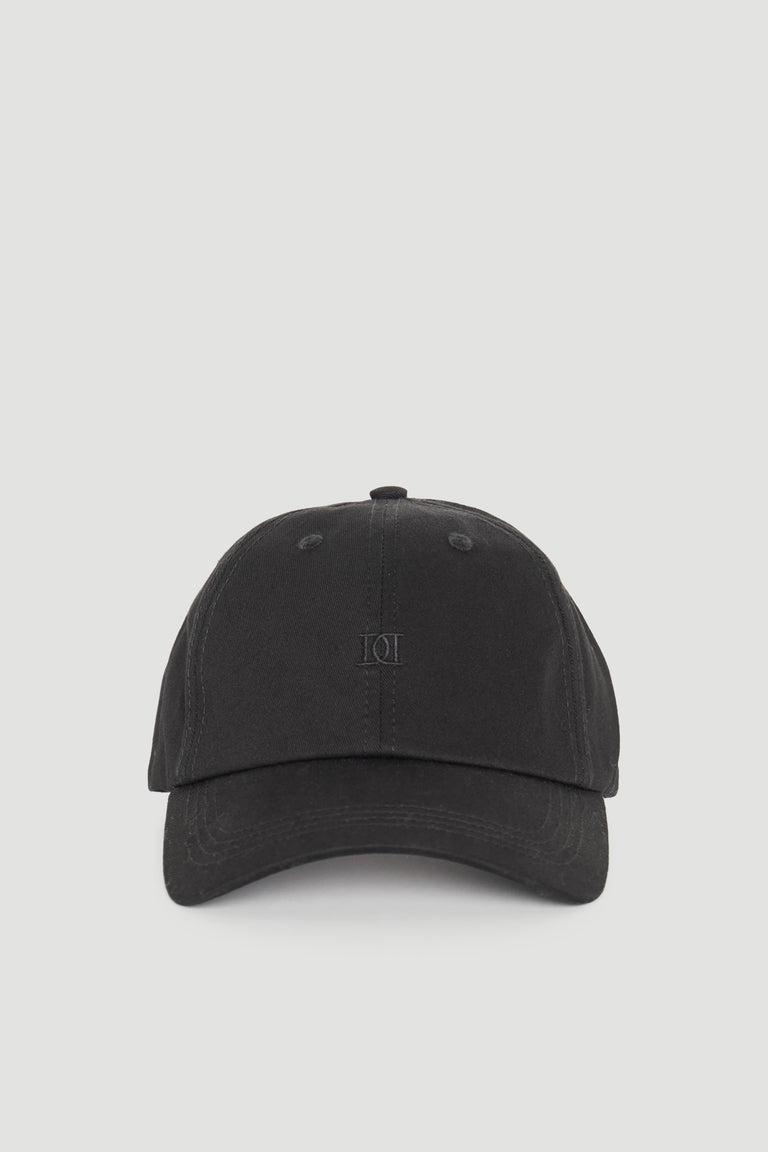 Minimalist black cap with subtle tonal logo embroidery for a sleek, versatile everyday accessory.