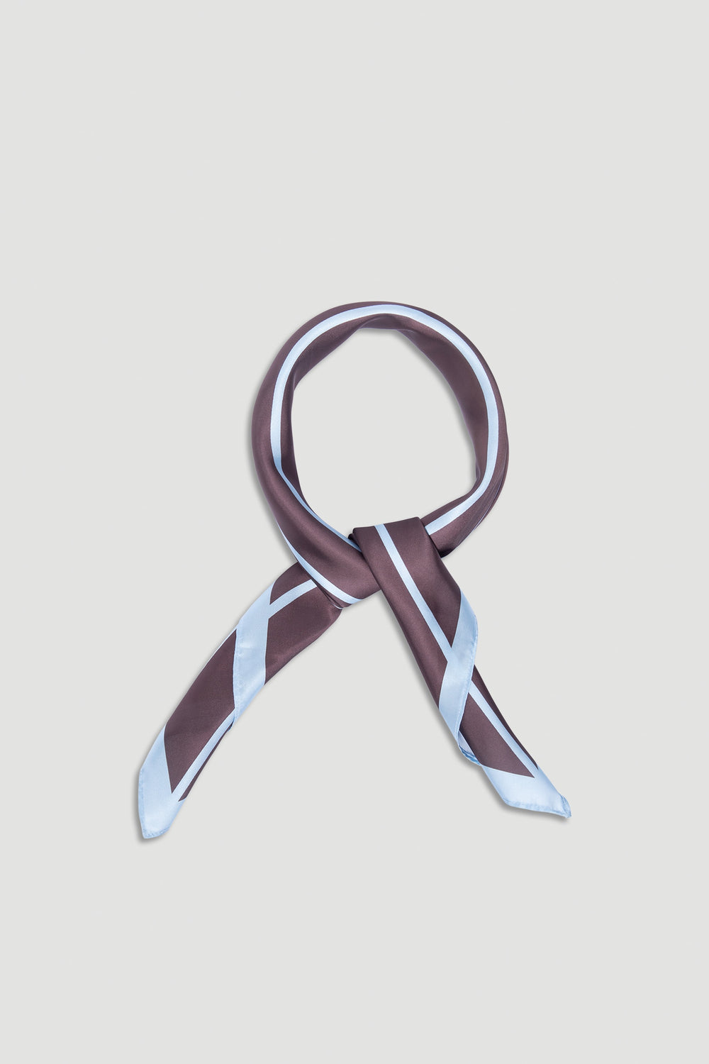 Polly Scarf featuring sleek brown and pale blue stripes, designed for versatile styling and effortless elegance by DECJUBA.