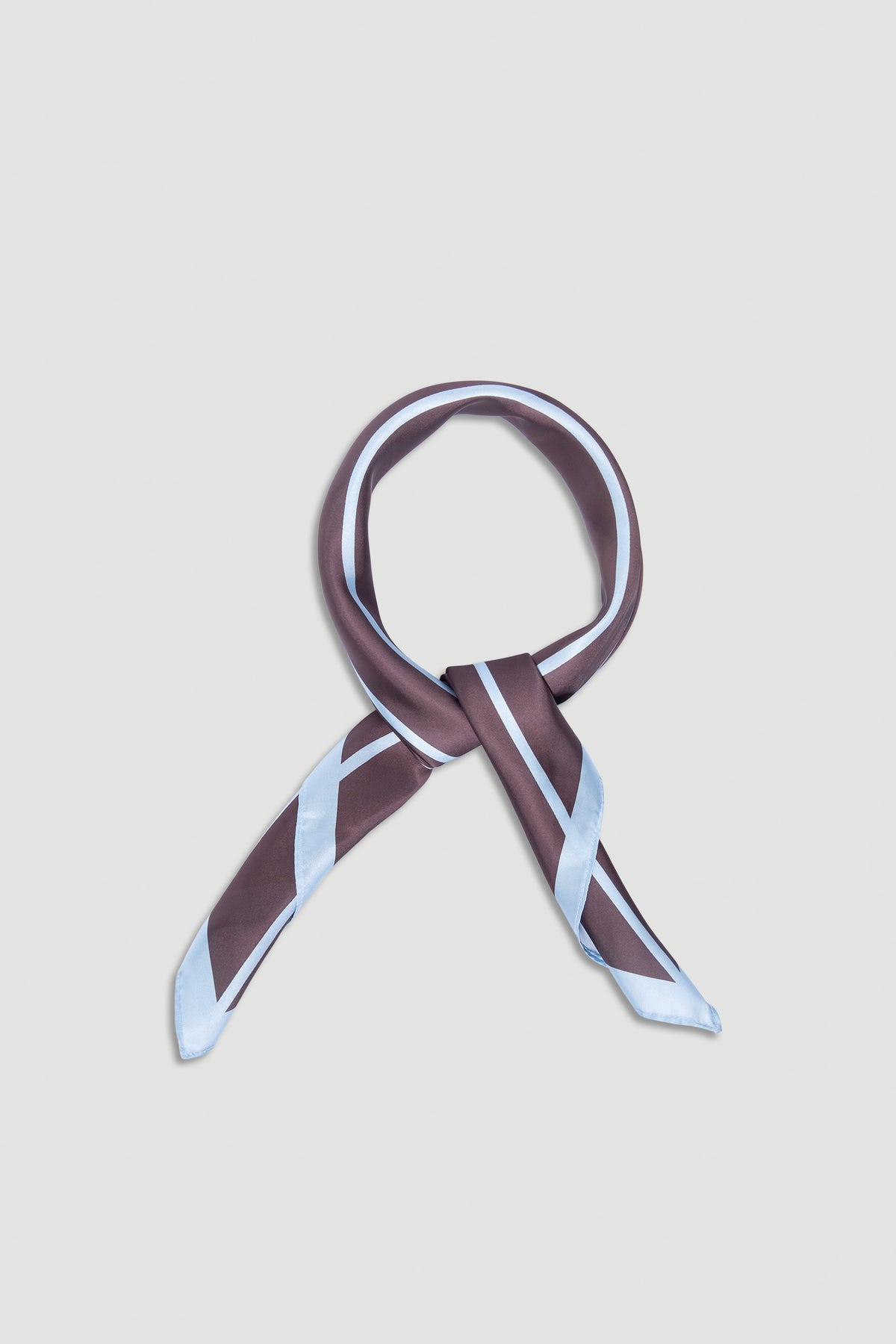 Polly Scarf featuring sleek brown and pale blue stripes, designed for versatile styling and effortless elegance by DECJUBA.