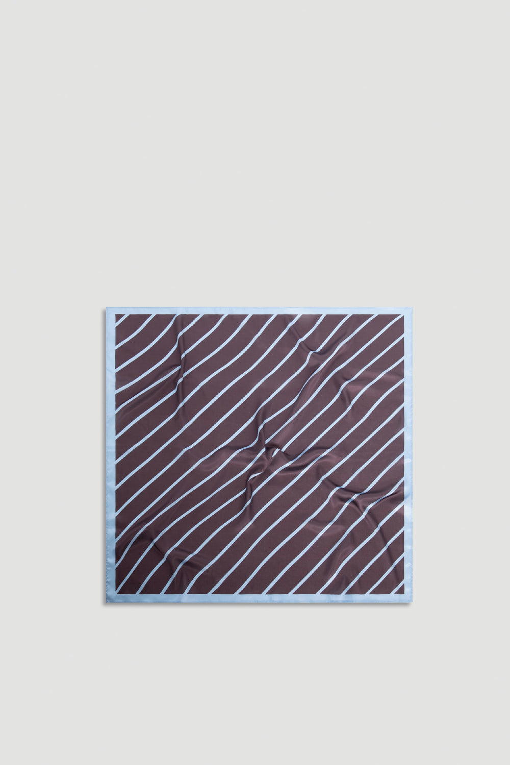 Polly Scarf featuring soft chocolate brown fabric with thin diagonal sky-blue stripes and a light blue border, effortlessly versatile.
