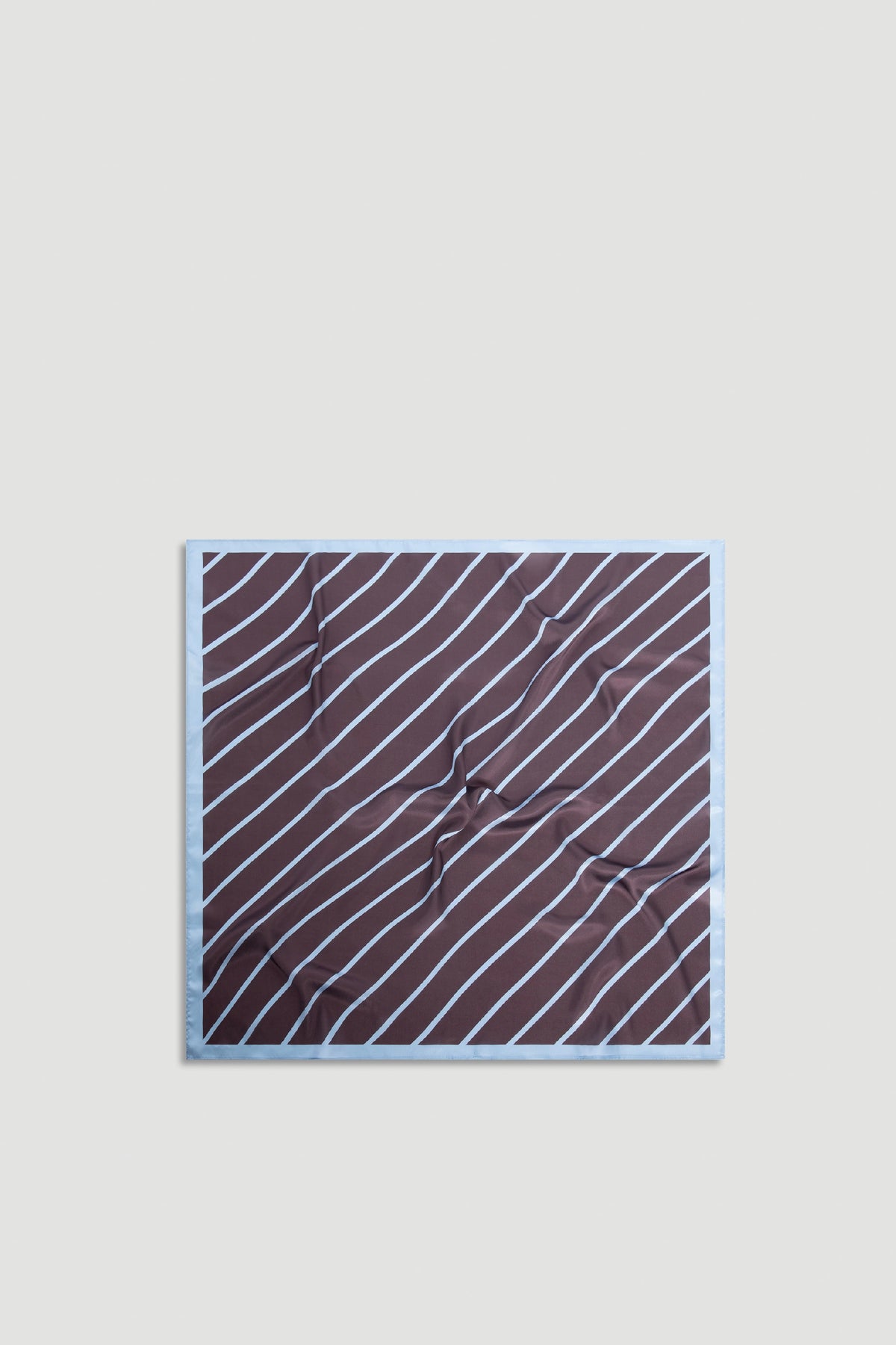 Polly Scarf featuring soft chocolate brown fabric with thin diagonal sky-blue stripes and a light blue border, effortlessly versatile.