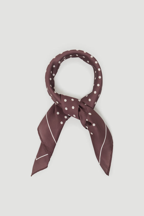 Polly Scarf in portrait view, lightweight smooth fabric with white polka dots and easy fold styling option