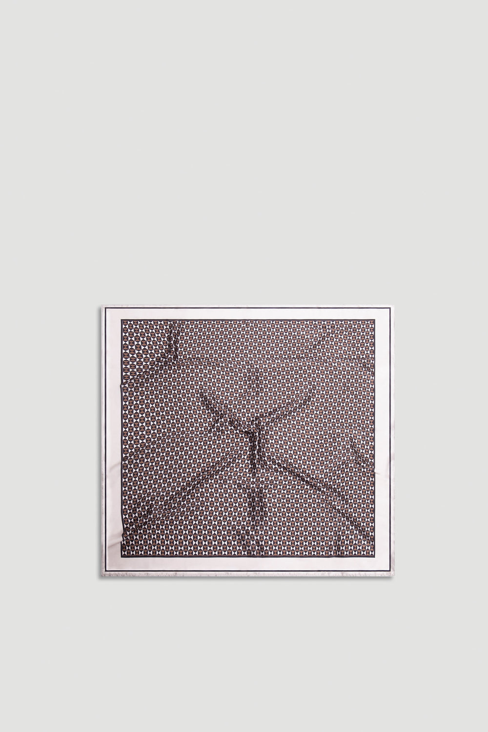 Polly Scarf with intricate geometric pattern in warm neutral tones framed by a soft light border for versatile styling.