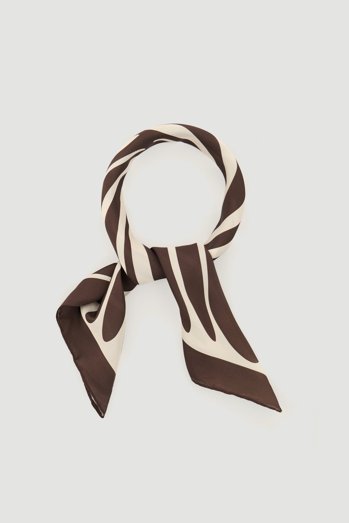 Brown and beige striped scarf with a smooth texture, styled in a simple circular knot against a light background.
