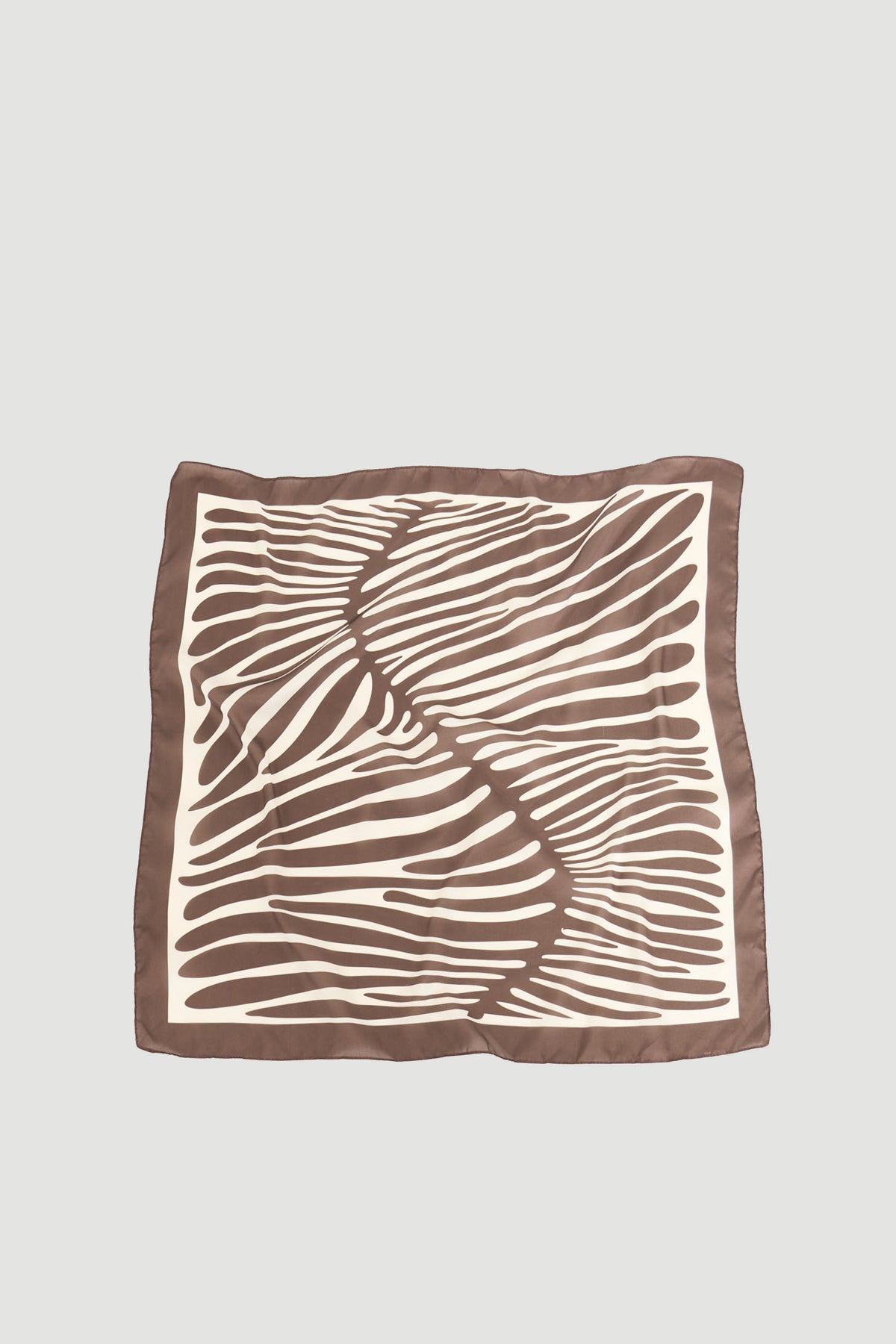 Square scarf featuring flowing brown zebra-inspired stripes on a cream background with a muted brown border.