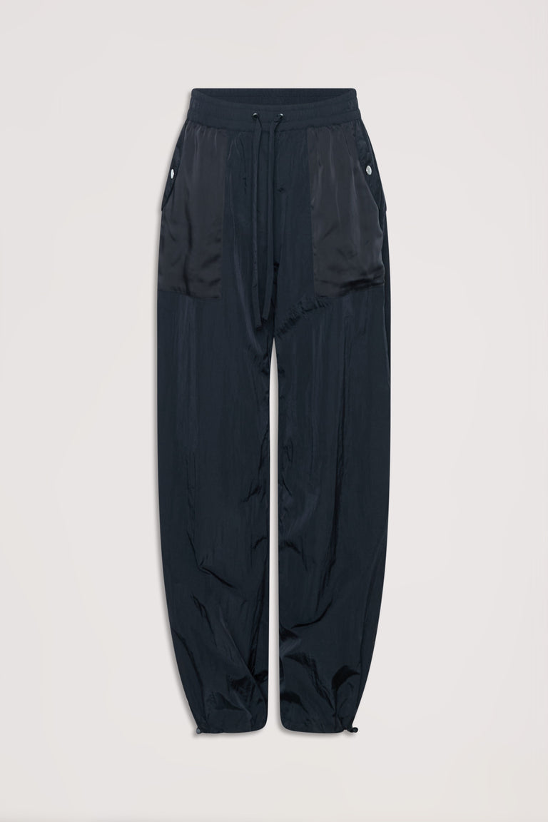 Black relaxed fit parachute-style joggers with drawstring waist and buttoned side pockets.