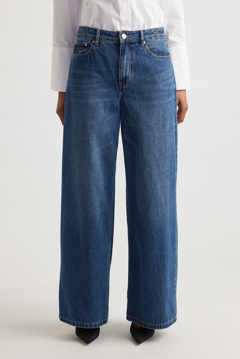 Front view of Elena Wide Leg Jean in classic denim with high waist and relaxed wide-leg fit by Decjuba Australian brand
