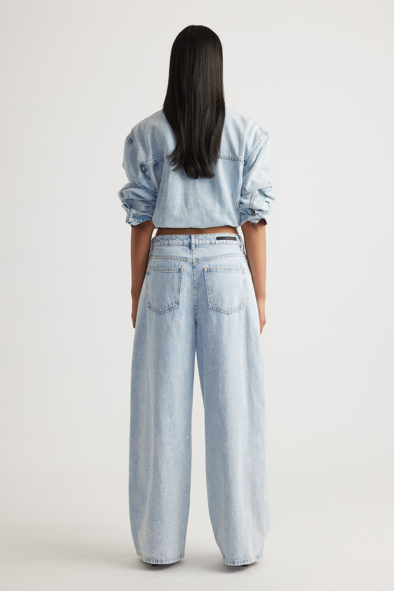 Rear view of Elena Wide Leg Jean in light denim styled with matching top by Decjuba Australian fashion brand
