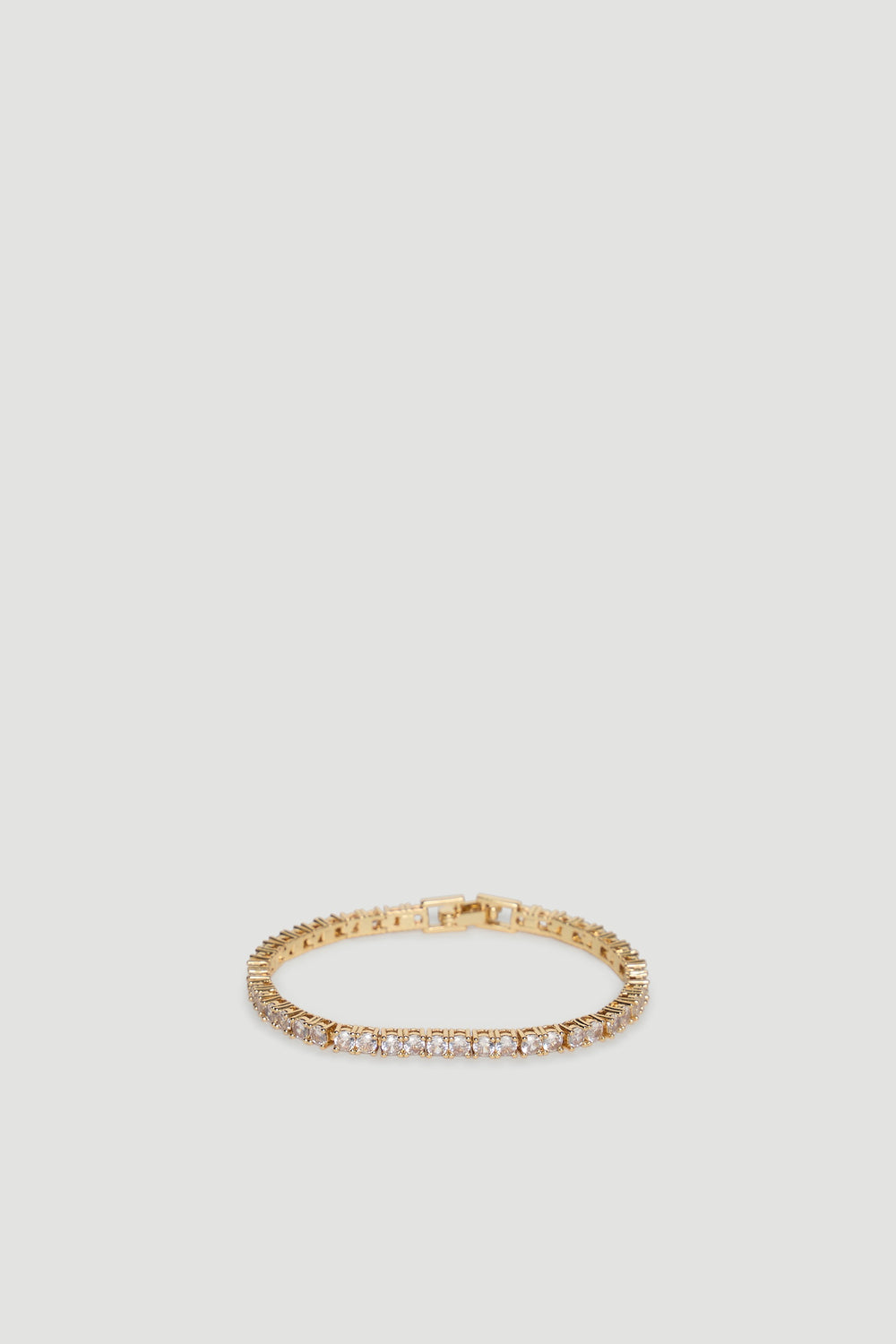 Elegant 9ct gold tennis bracelet featuring a continuous row of sparkling stones for a refined, timeless look.
