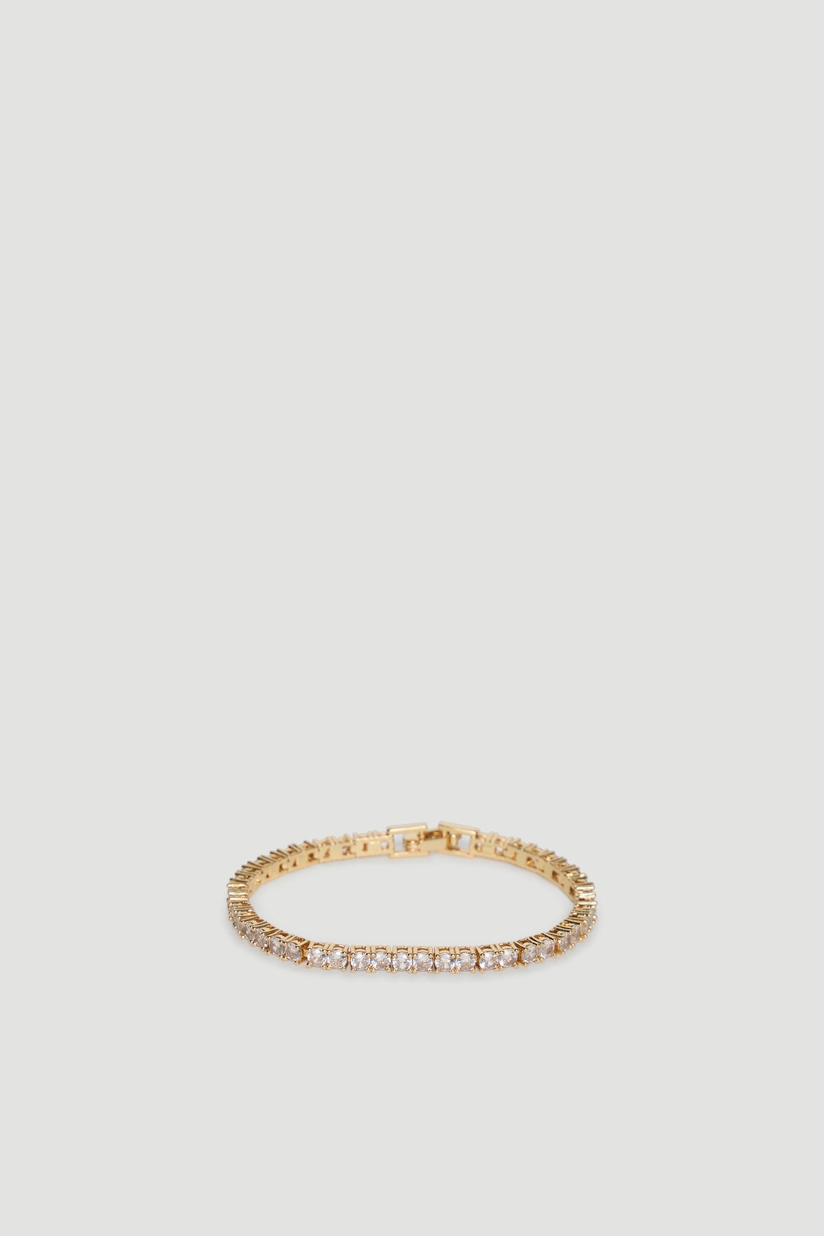 Elegant 9ct gold tennis bracelet featuring a continuous row of sparkling stones for a refined, timeless look.