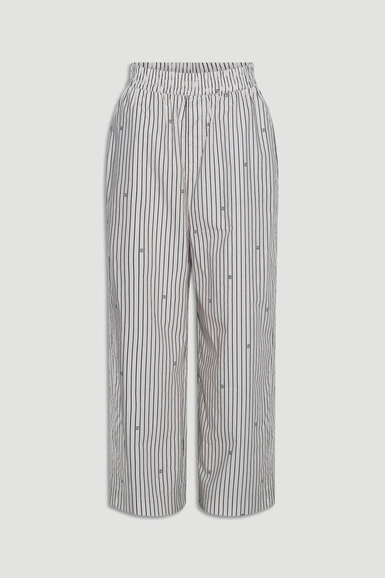 Light-colored wide-leg pants with vertical stripes and subtle monogram details, featuring an elasticated waistband.