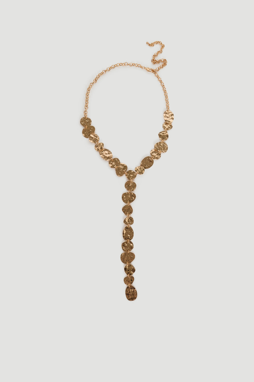 Gold-tone lariat necklace with hammered circular discs and adjustable chain for a chic, versatile finishing touch.