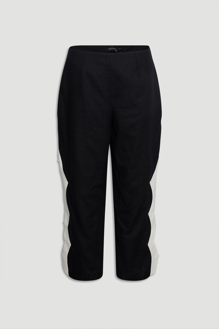 Tess Scallop Pant front view in gallery position 4 with black fabric and contrast white scalloped side panels.