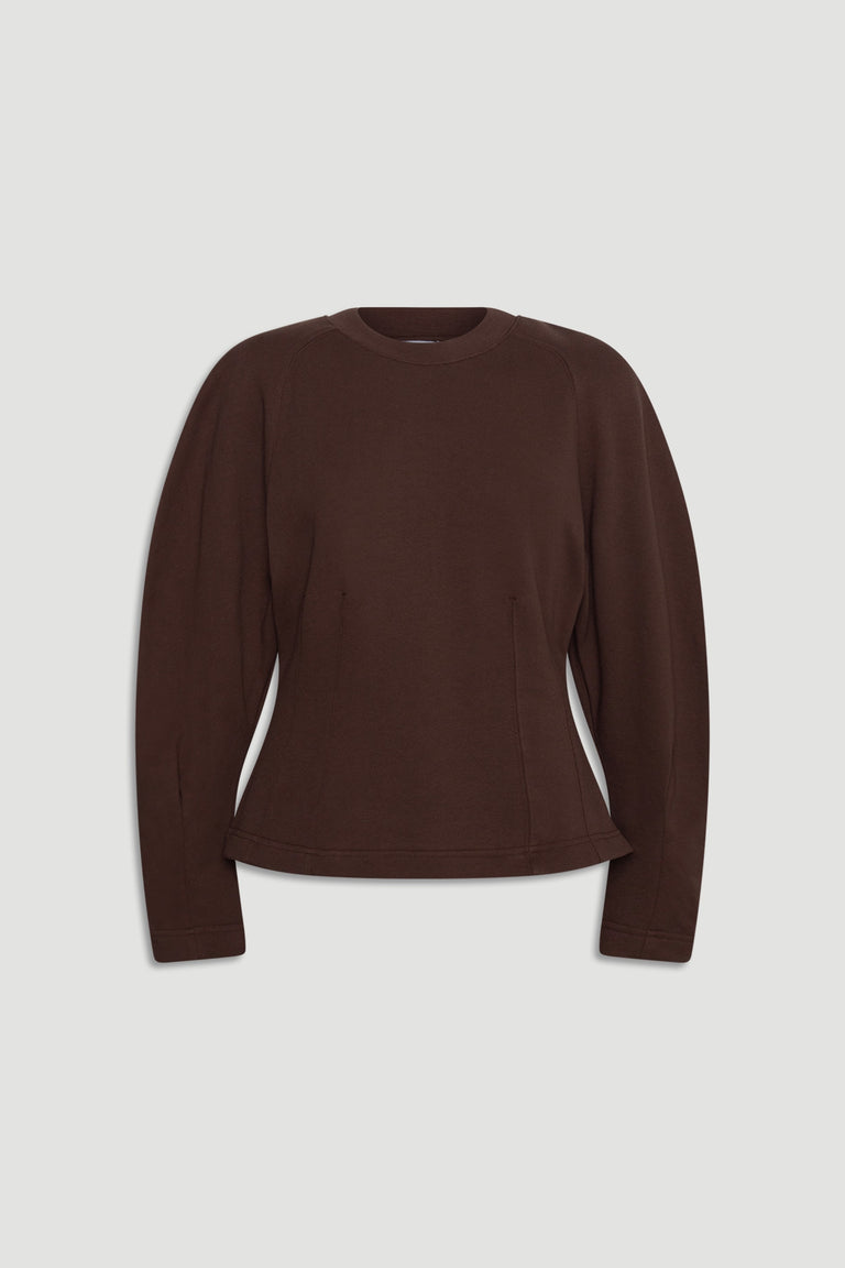 Dark brown long sleeve top with a cinched waist and structured silhouette for a polished casual look