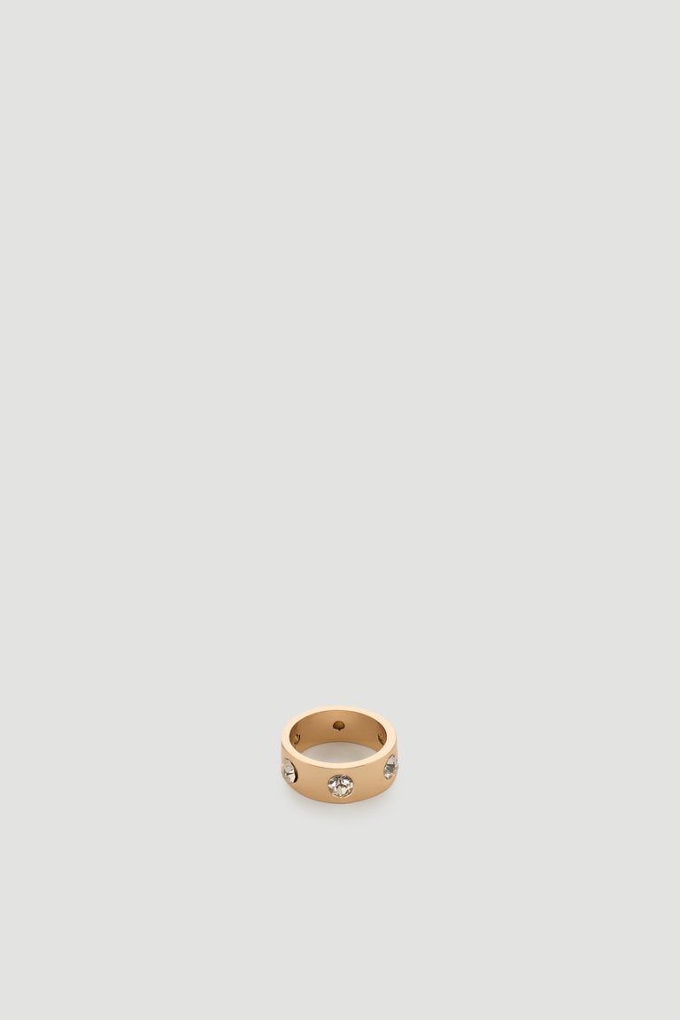 Gold-tone band ring featuring evenly spaced sparkling diamante stones for a chic, modern finish