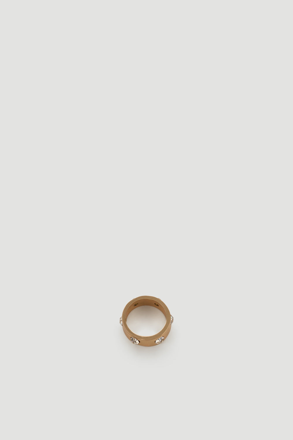 Gold-tone ring with sparkling diamante accents for a subtle yet elegant statement accessory