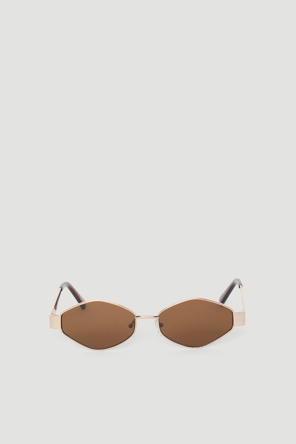 Hexagon-shaped sunglasses featuring warm brown lenses and slim metallic frames with matching brown arms
