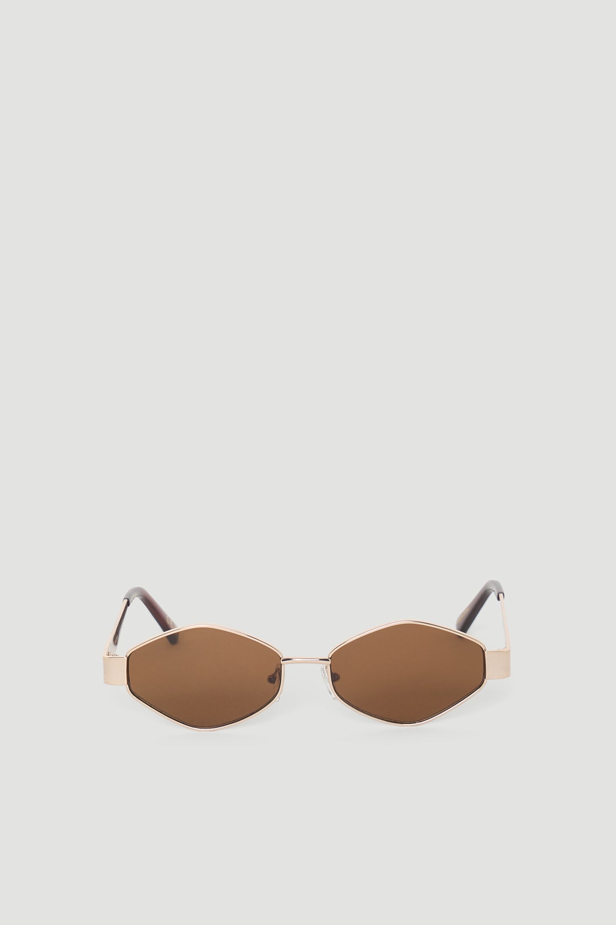 Hexagon-shaped sunglasses featuring warm brown lenses and slim metallic frames with matching brown arms