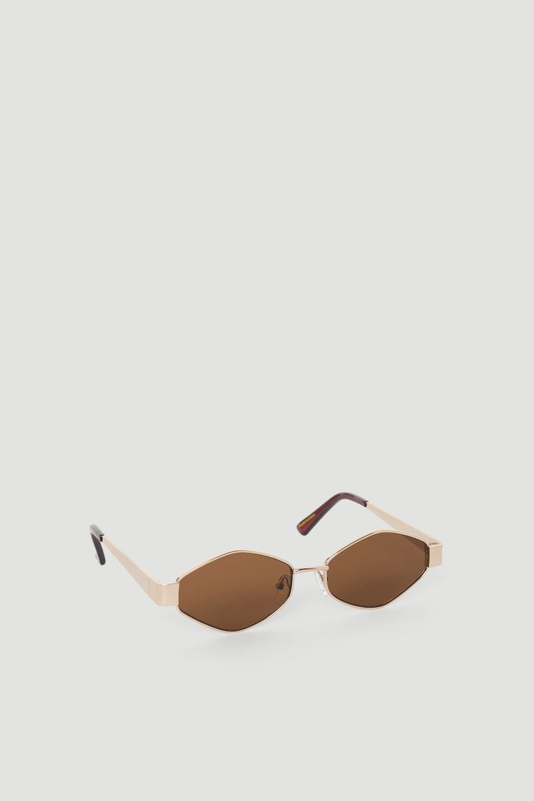 Hexagon-shaped sunglasses with beige frames and brown tinted lenses for a stylish, modern look.