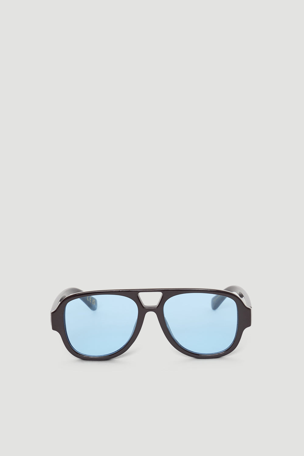Aviator style sunglasses with a bold dark frame and soft blue lenses for a modern, stylish look.
