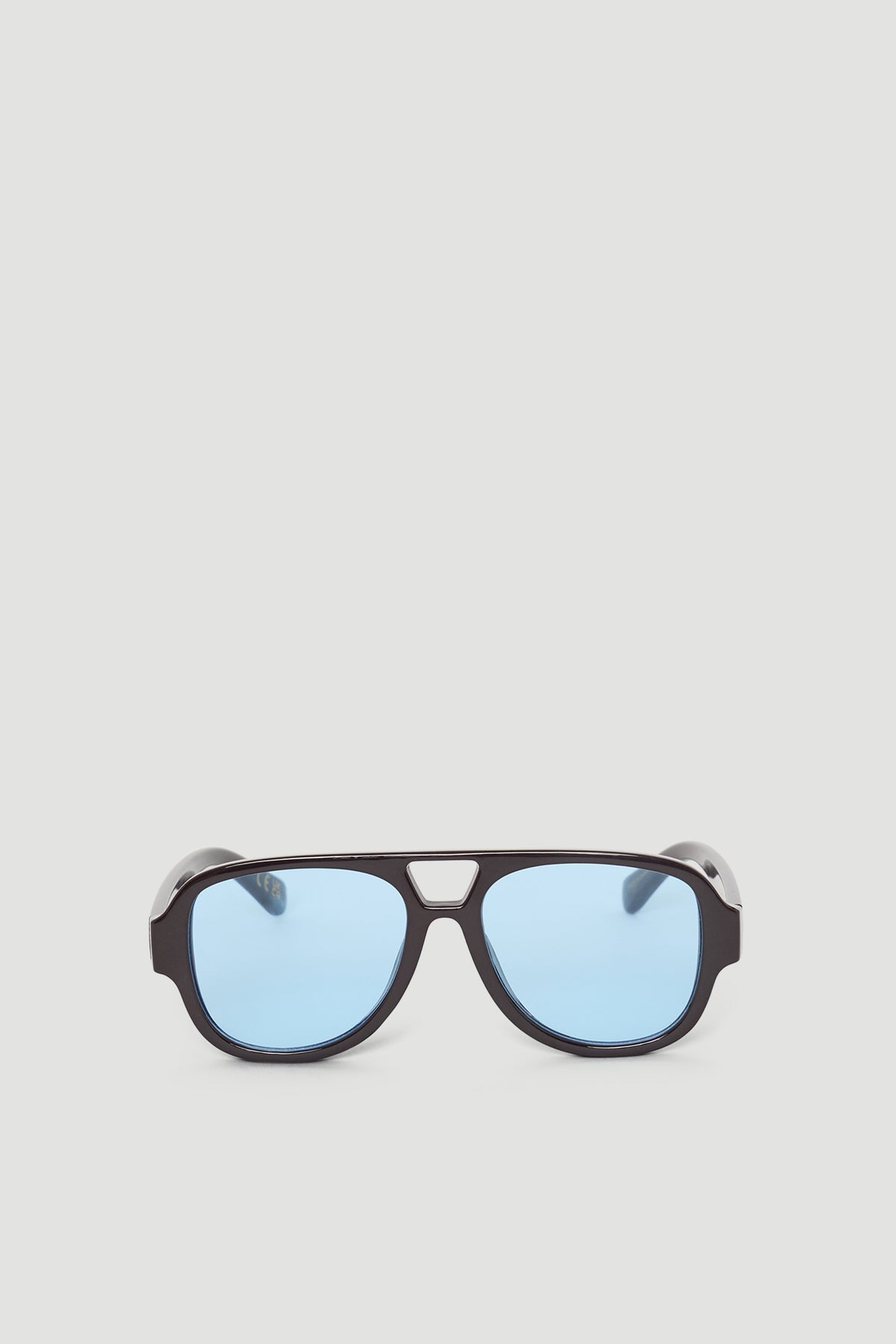 Aviator style sunglasses with a bold dark frame and soft blue lenses for a modern, stylish look.