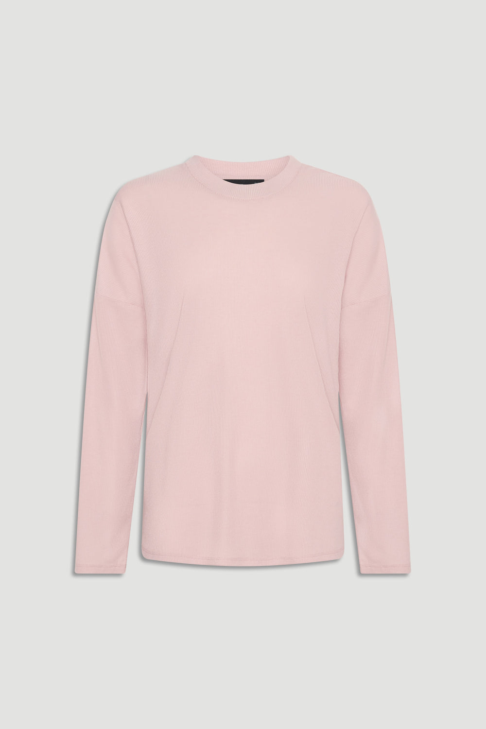 Soft pink long sleeve ribbed top with crew neckline for a versatile, comfortable everyday look