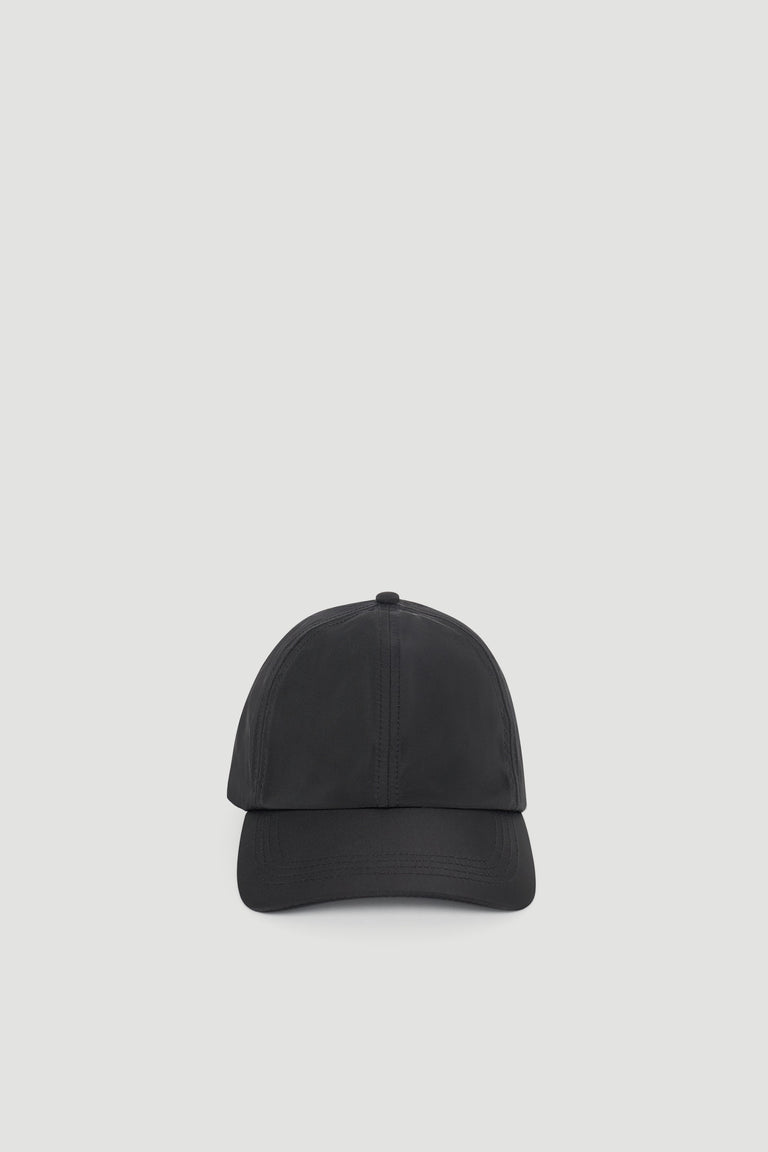 Minimalist black cap with a sleek, smooth finish designed for effortless everyday styling.