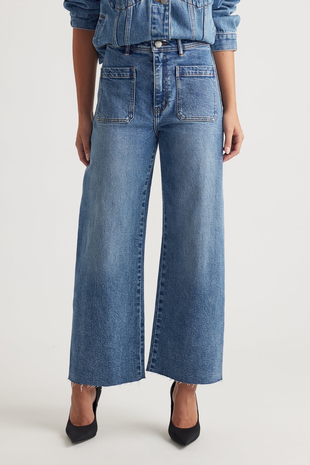 Darcy Cropped Wide Leg Jean in classic blue denim with front patch pockets and raw hem by DECJUBA Australian fashion brand