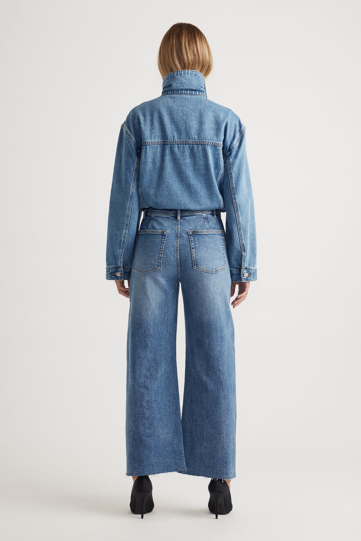 Darcy Cropped Wide Leg Jean in classic blue denim with high waist and raw hem, styled with matching denim jacket by DECJUBA Australian brand