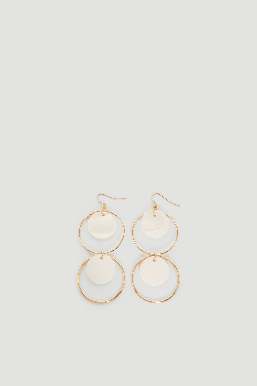 Tina Circle Earrings featuring gold hoops with mother-of-pearl discs, elegant and versatile by DECJUBA Australian fashion brand