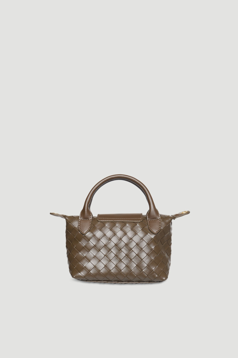 Brown mini handbag with woven texture, top handles, and zip closure against a light neutral background