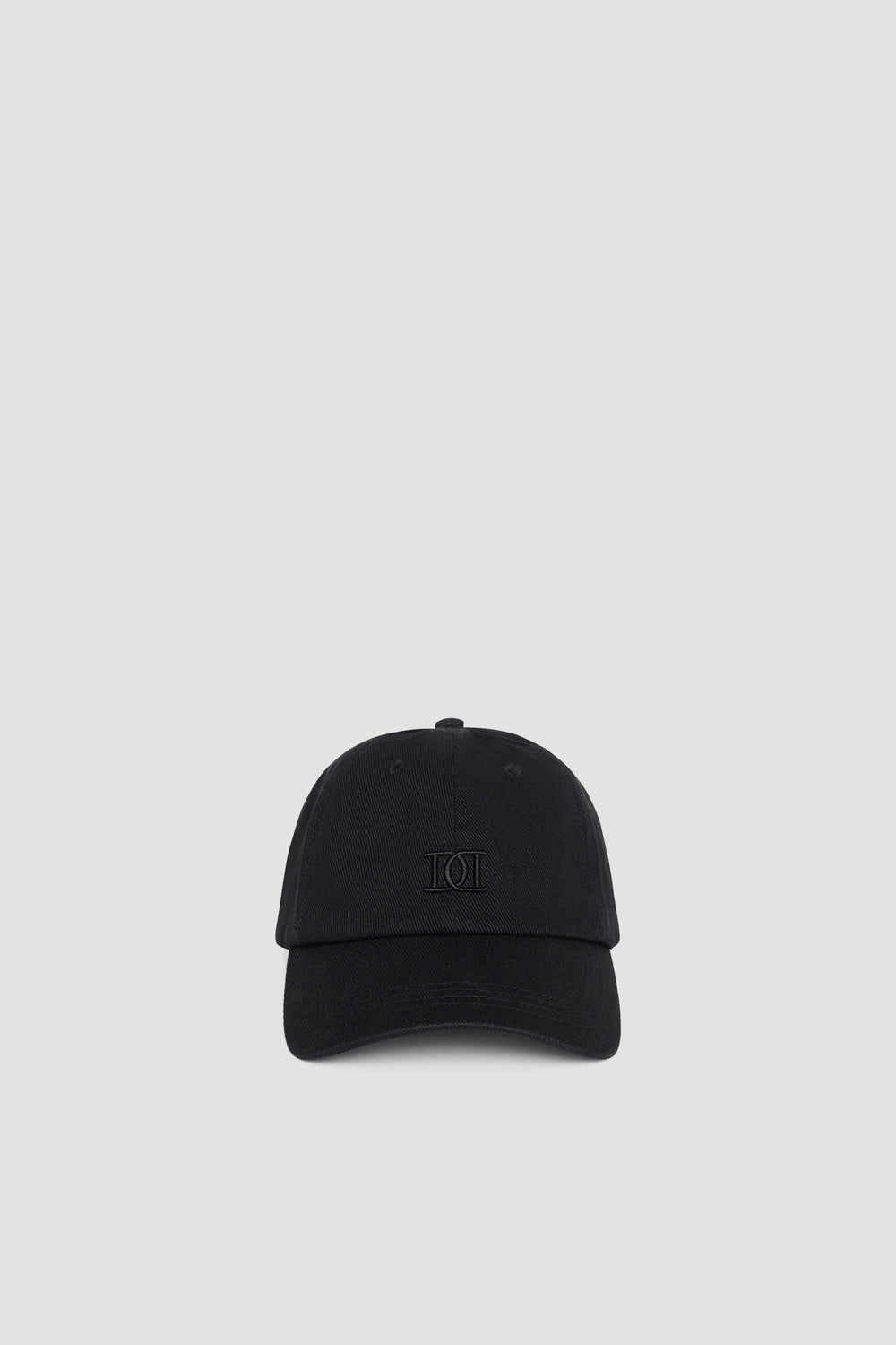 Classic black vintage-style cap with subtle tonal logo embroidery, designed for everyday effortless wear.