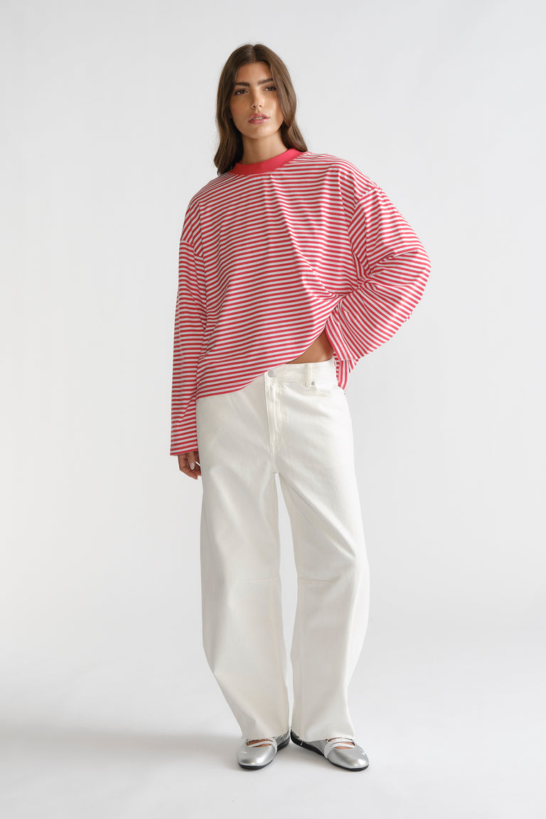 D-Luxe Long Sleeve Stripe Tee in red and white stripes paired with wide-leg white denim for a relaxed look by Decjuba Australian brand