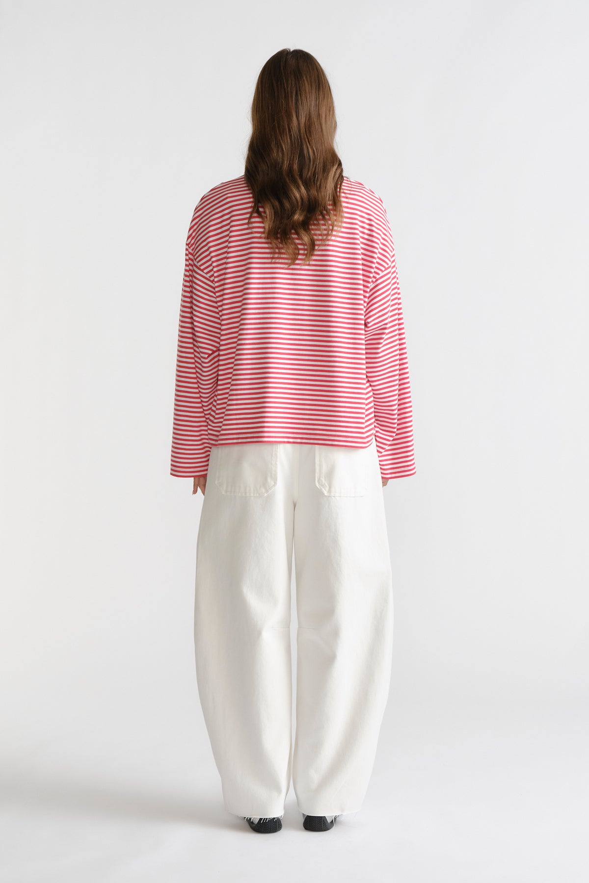 D-Luxe Long Sleeve Stripe Tee in red and white stripes paired with wide-leg white denim trousers by DECJUBA Australian brand